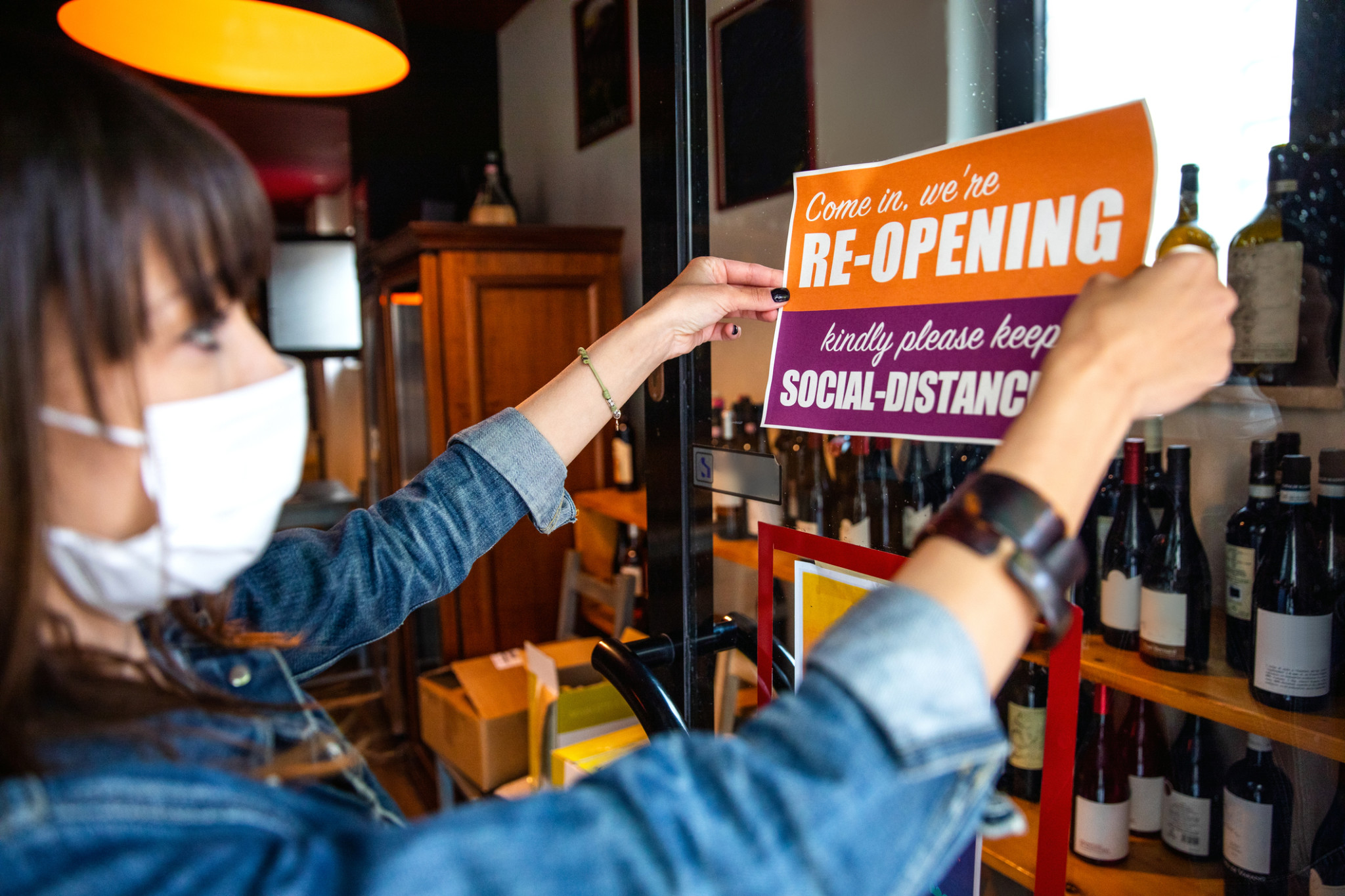 Re-opening sign in a small business | business insurance