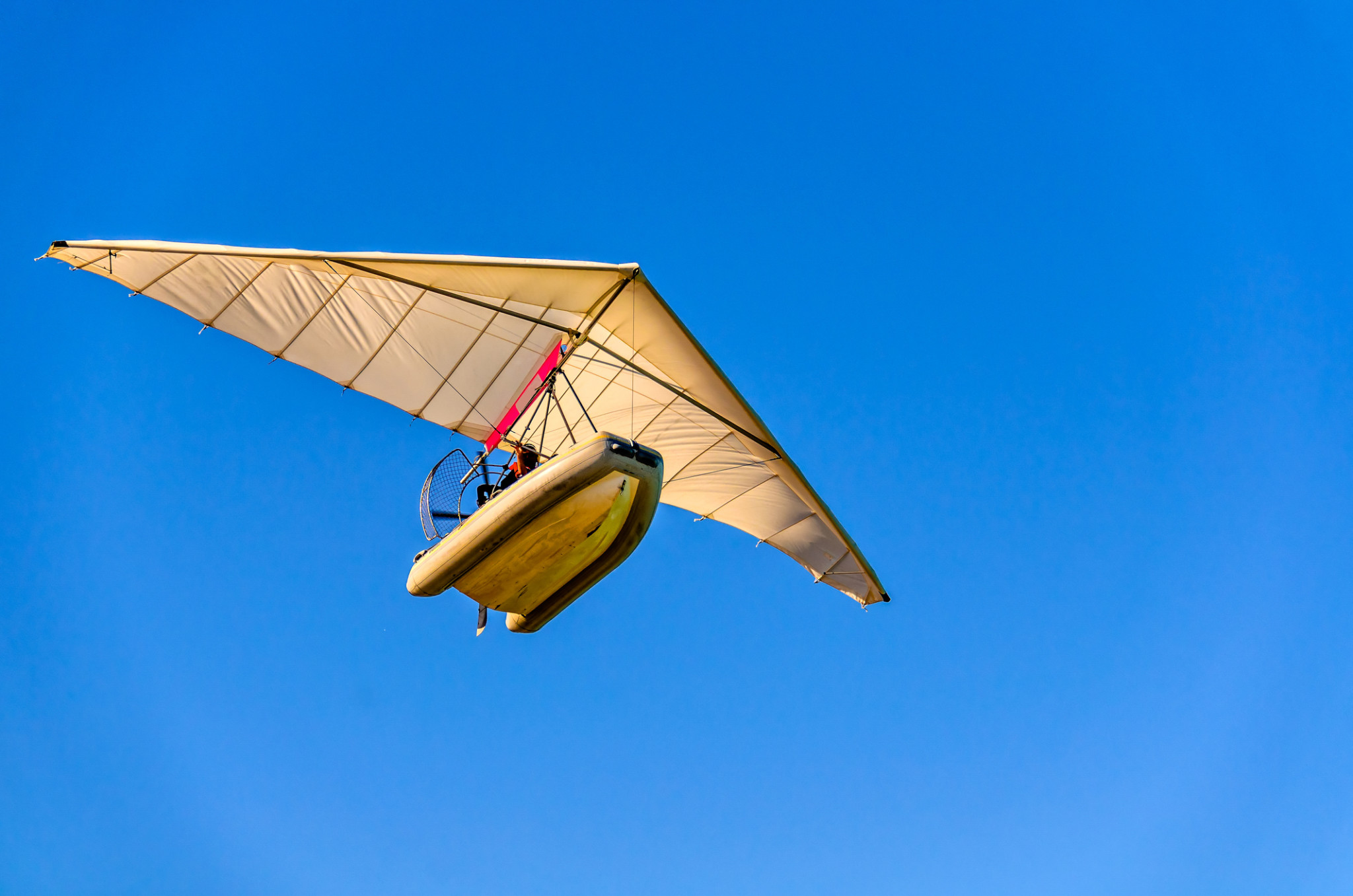 air trike with propeller flying in the blue sky | Insurance for floats and ultralights