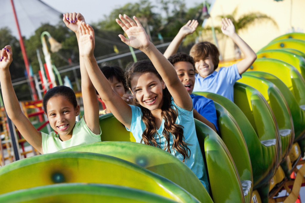Children riding a roller coaster ride